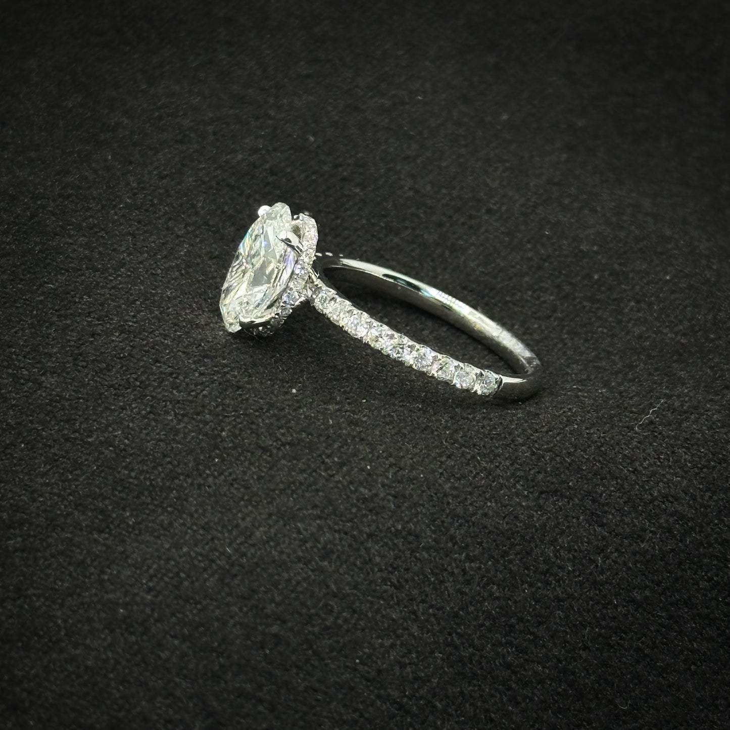 Oval shape, half pave band