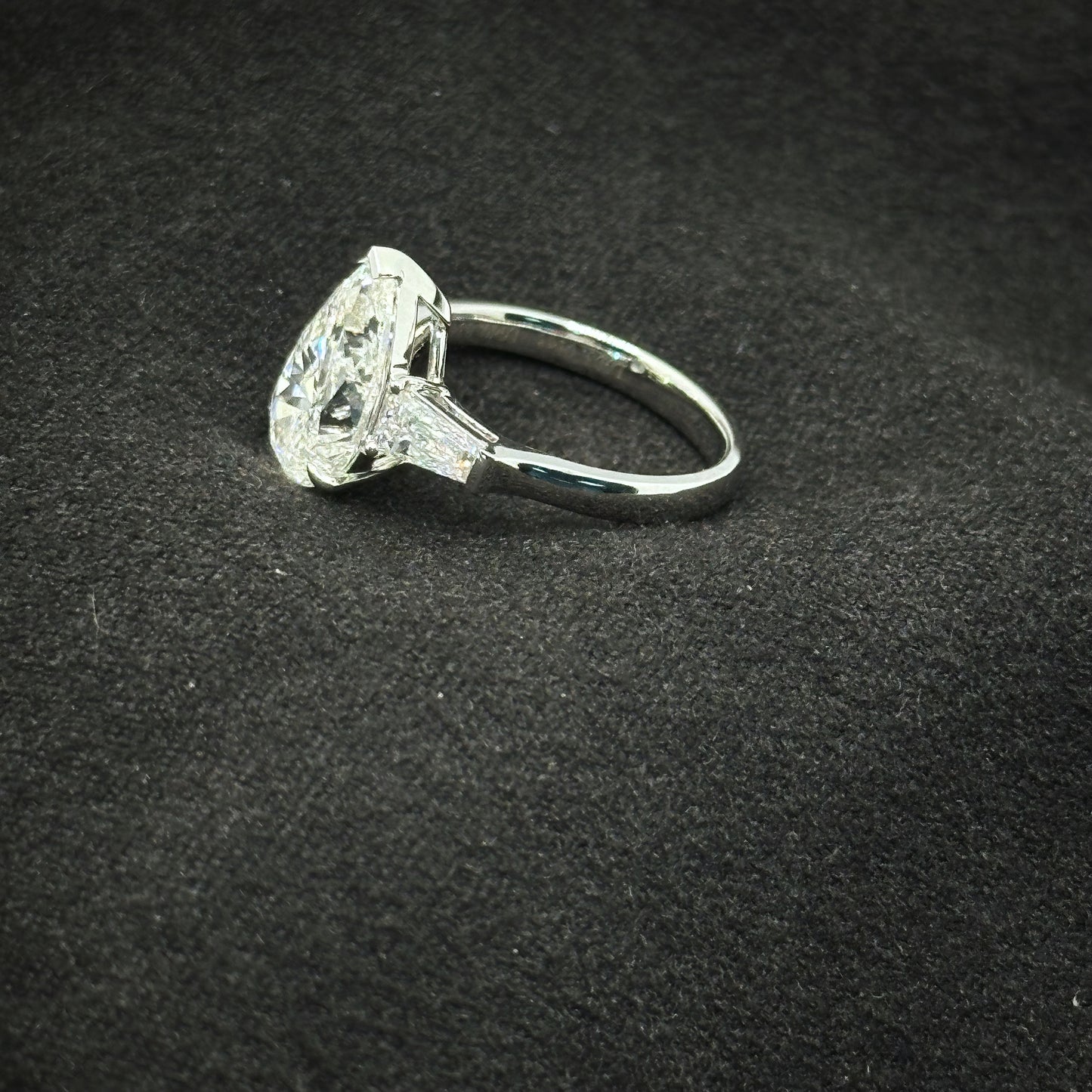 Pear shape, three stone ring