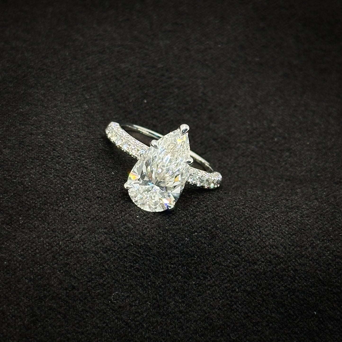 Pear shape, half pave band