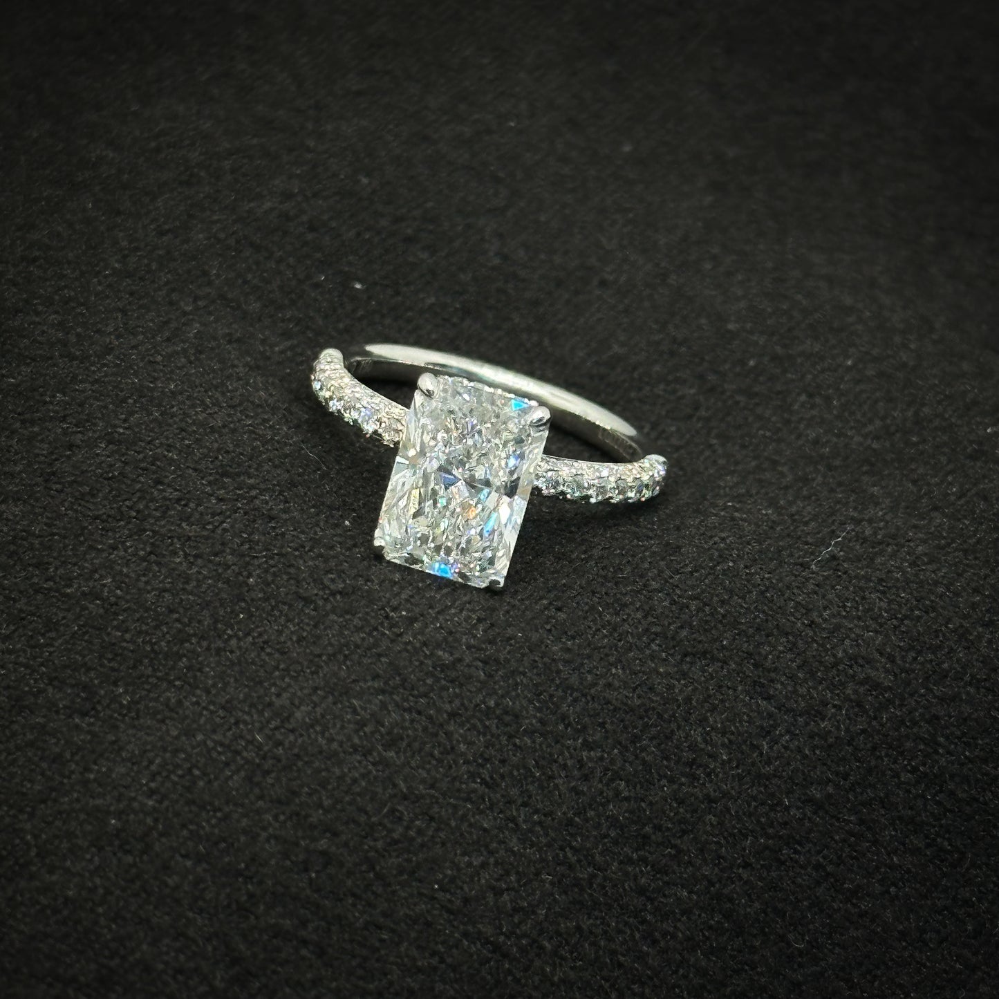 Radiant cut, half pave band