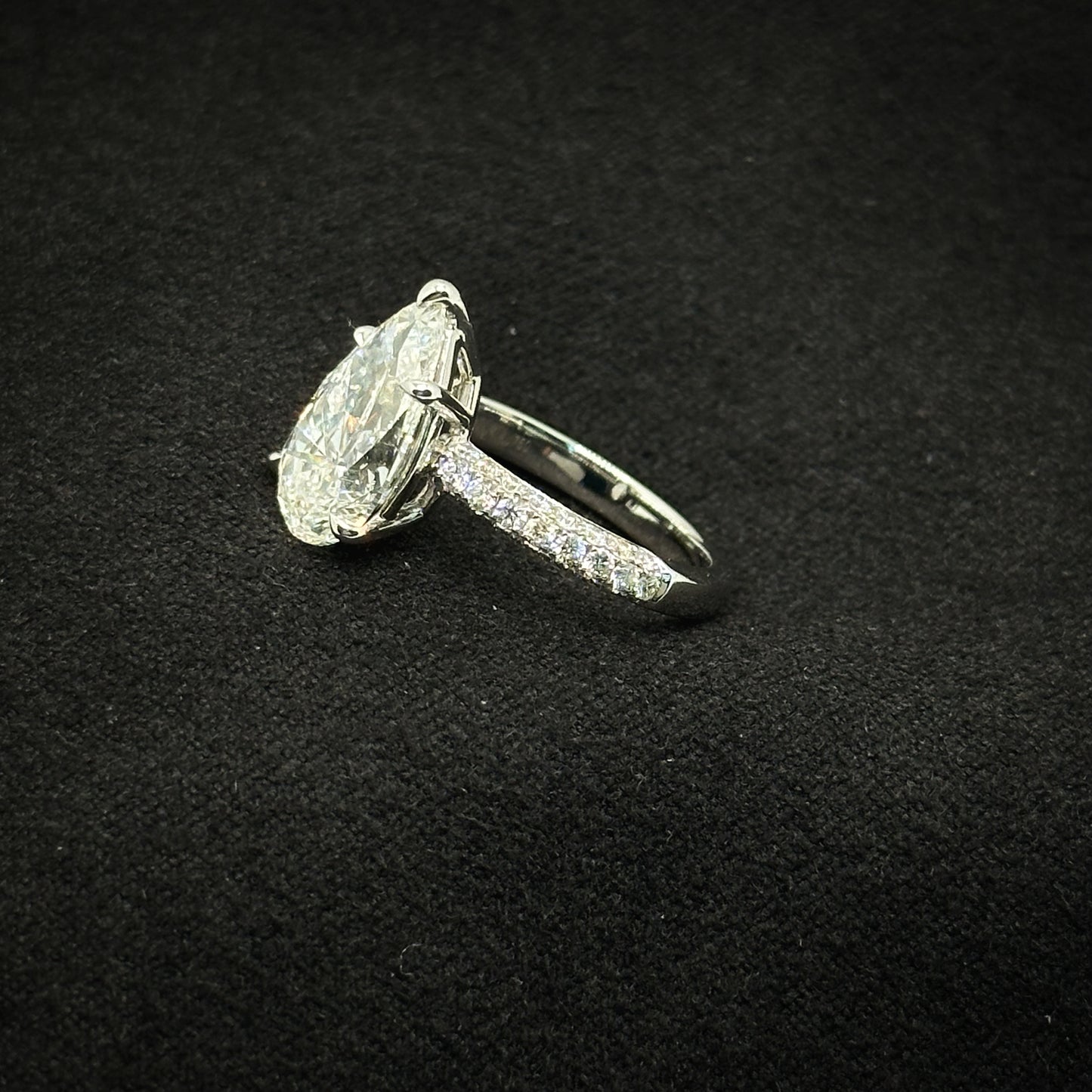 Pear shape, half pave band
