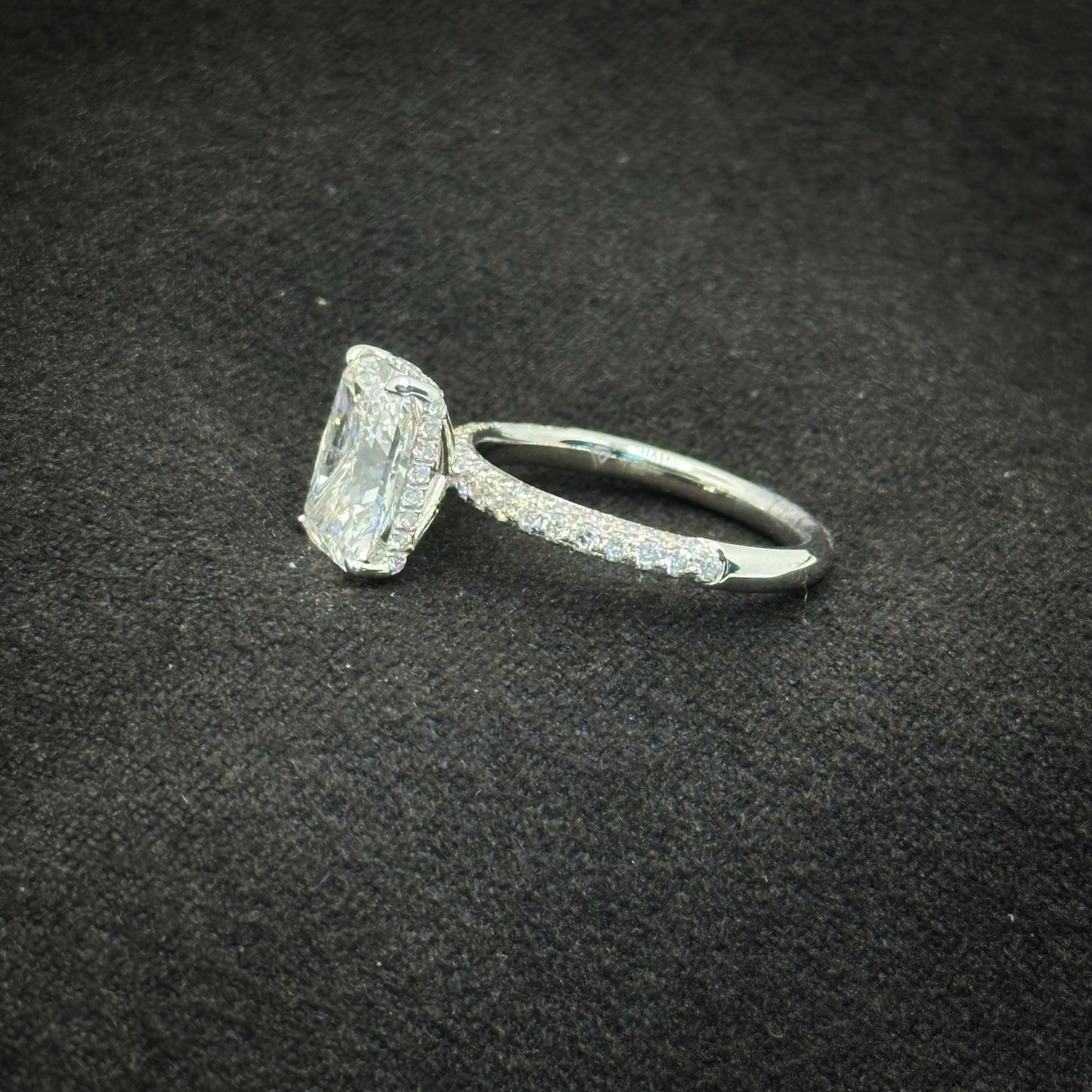 Radiant cut, half pave band