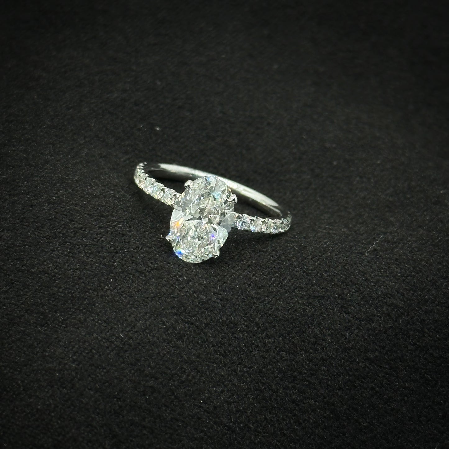 Oval shape, half pave band