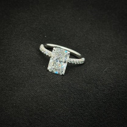 Radiant cut, half pave band